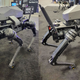 Two images of the Sword robot dog with a rifle strapped to its back